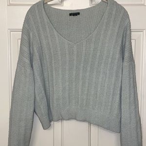 Light bluish gray crop sweater.